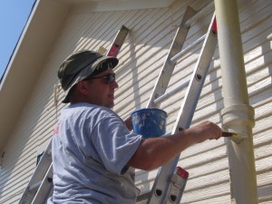 Tim painting the pole